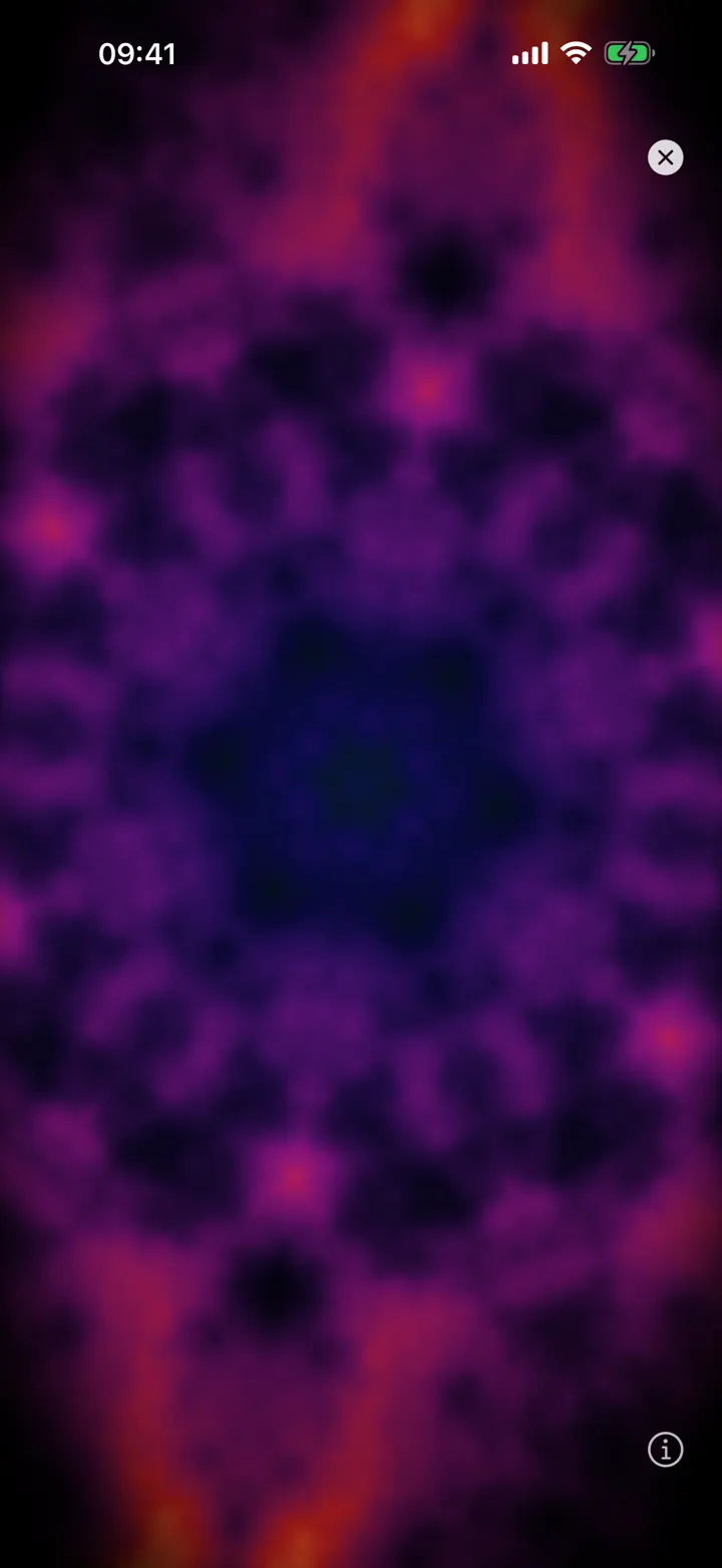 The kaleidoscope visualizer filling the screen in purple and pink.